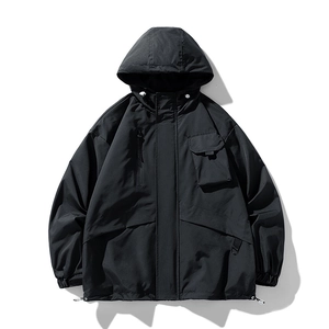 Men's black hooded outdoor techwear jacket with utility cargo pockets and windproof fabric