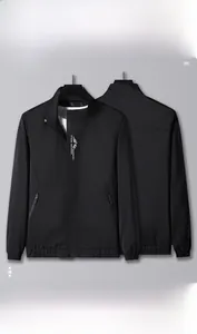 Detail view of black casual jacket with stand-up collar, front zipper, and printed logo