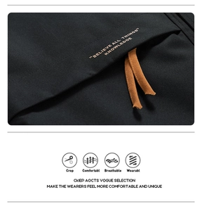Detail of casual jacket zipper with brown pulls on textured black twill fabric
