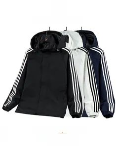 Detailed comparison of three hooded windbreaker jackets in black, white, and navy blue