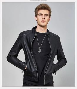 Detail of quilted shoulder stitching on black faux leather biker jacket with stand collar