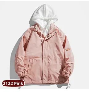 Detail of light pink casual jacket showing zipper closure and elastic cuffs with text