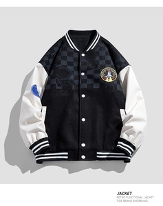 Detailed close-up of retro varsity jacket with space mission badge and checkered pattern