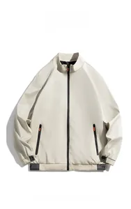 Detail of off-white stand collar jacket featuring orange zipper pockets and ribbed cuffs