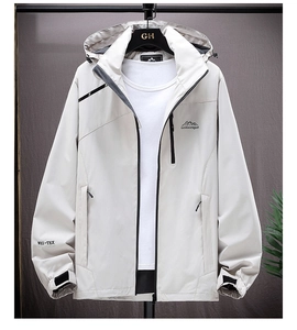 Detail of grey waterproof jacket showing adjustable hood and tech logo embroidery
