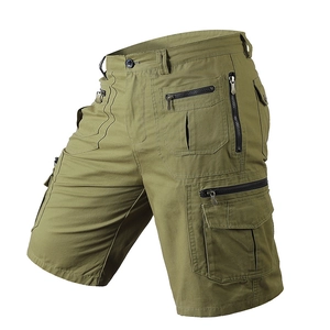 Detail view of olive green cargo shorts featuring multiple utility pockets and metal zippers