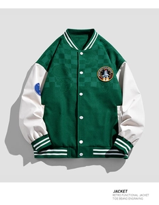Detail of green baseball jacket showing space shuttle badge and ribbed striped cuffs