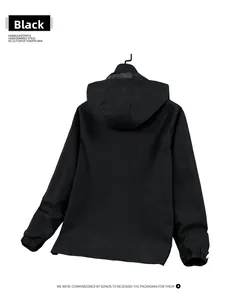 Rear view of black hooded windbreaker jacket with elastic cuffs and a minimalist design
