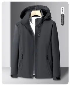 Close-up of the dark gray men's hooded jacket with a zipper pocket and velcro cuffs