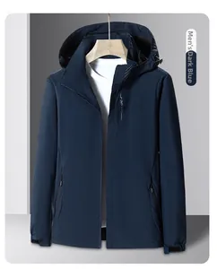 Detailed view of men's dark blue outdoor jacket featuring a hood and secure zipper pocket