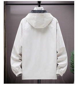 Rear view of white windproof hooded jacket with grey lining and elastic cuffs