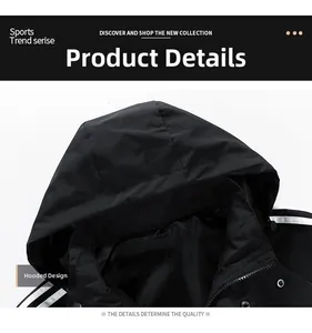 Detail of black hooded jacket showing windproof fabric and metallic snap button closure