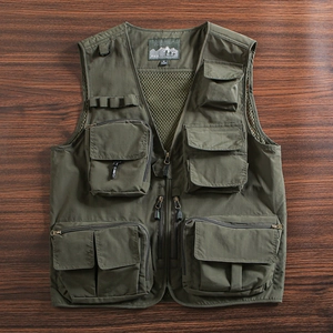 Detailed macro view of olive green multi-pocket utility vest with durable metal hardware