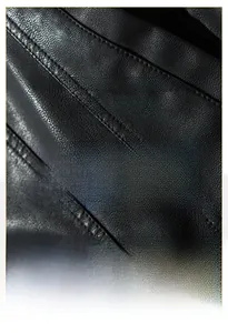 Close-up of premium black PU leather with litchi texture showing durability and warmth