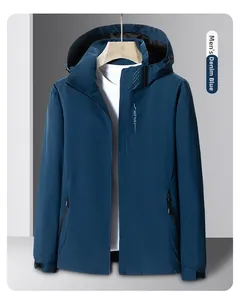 Close-up of denim blue men's outdoor jacket with zipper pockets and logo print