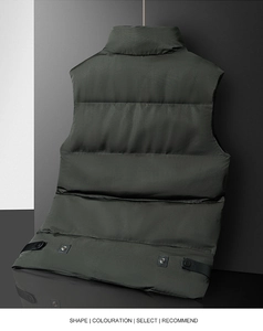 Detail of dark green men's quilted puffer vest with adjustable hem and metallic snap button