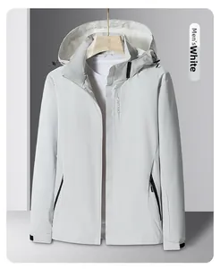 Detailed view of men's white windbreaker jacket with drawstring hood and zipped pockets