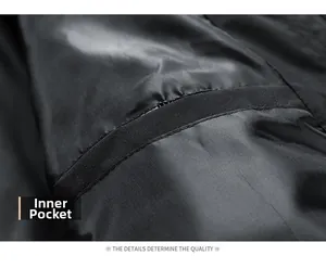 Close-up of the inner pocket construction on black oxford jacket showing stitch quality