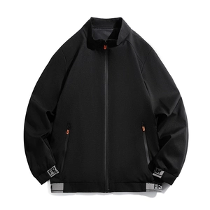 Men's black stand-collar windproof jacket with Freedom printed cuffs and orange zipper detail