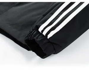 Detailed macro view of the elastic sleeve cuffs with iconic white triple stripe design