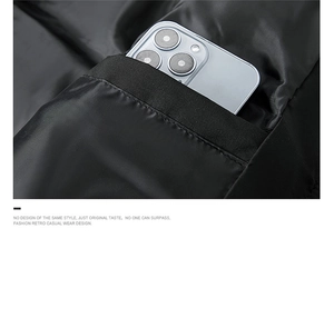 Detail of deep reinforced side pocket on men's winter vest holding a large smartphone