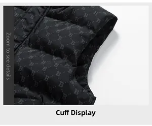 Close-up of quilted black vest sleeve cuff featuring textured letter patterns