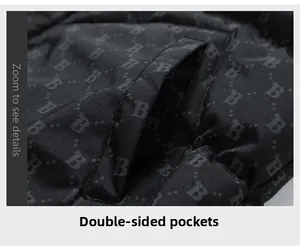 Detail view of winter vest featuring letter print fabric and functional double side pockets