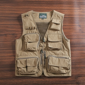 Macro view of khaki outdoor utility vest featuring multi-pockets and breathable mesh lining