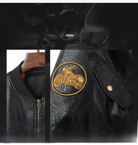 Detail of the embroidery patch on the sleeve and ribbed collar of the biker leather jacket