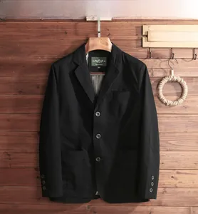 Detail view of black casual blazer with reinforced elbow patches and patch pockets