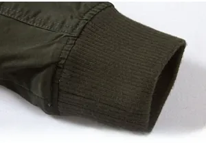 Close-up of olive green cargo jacket showing premium ribbed cuffs and durable fabric texture