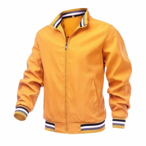 Detail of ginger yellow bomber jacket with multi-colored striped ribbed cuffs and collar