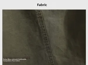 Detail of dark olive cotton fabric with twill texture and double stitching for durability