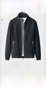 Detail of black bomber jacket with ribbed collar and windproof synthetic fabric