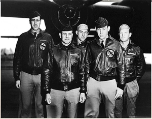 Detail of WWII A-2 flight jacket showing circular eagle crest embroidery and leather texture