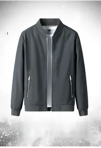 Detail of grey men jacket featuring embroidered text Be an Artist of Life on the chest