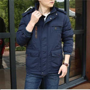 Detail of dark blue windproof winter jacket with R Design embroidery and utility pockets