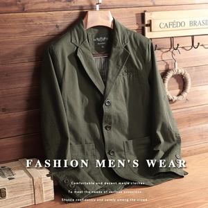 Detail of army green canvas blazer with classic lapels and reinforced elbow patches