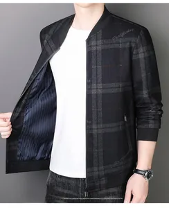 Close-up of grey plaid baseball jacket with red stripes and high-quality metal zipper