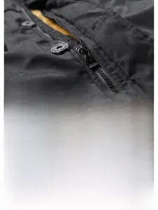 Close-up of durable black twill fabric with metal zipper and fashion leather patch detail
