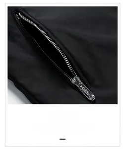 Detailed close-up of a high-quality metal zipper on a black men's jacket side pocket