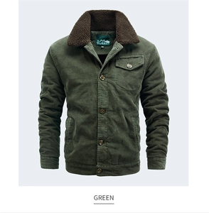 Detail view of men's dark green corduroy jacket with warm brown faux fur collar and pocket
