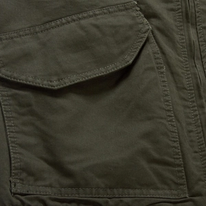 Men's olive green flight jacket featuring military-style patch pockets and twill fabric
