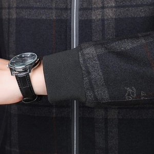 Men's dark grey plaid jacket with ribbed cuff and stylish leather strap wristwatch