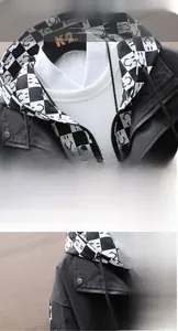 Detail of men's hooded jacket featuring black windproof fabric and checkerboard lining
