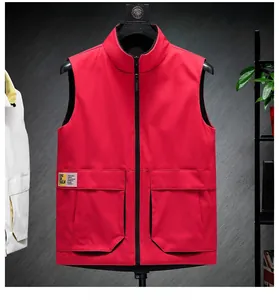 Detail view of red stand collar vest featuring utility flap pockets and full zipper closure
