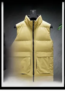 Detail view of yellow stand collar vest showing waterproof fabric and large flap pockets