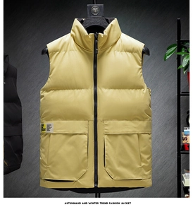 Detail of yellow standing collar puffer vest featuring large pockets and woven patch