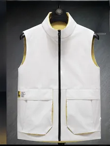 Detail of white stand collar vest with yellow lining and decorative pocket label