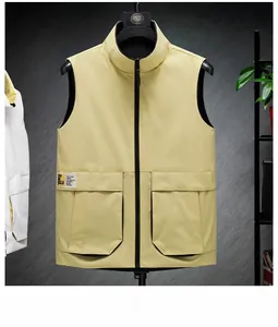 Detail of light beige vest with stand collar and large flap pockets with urban patch